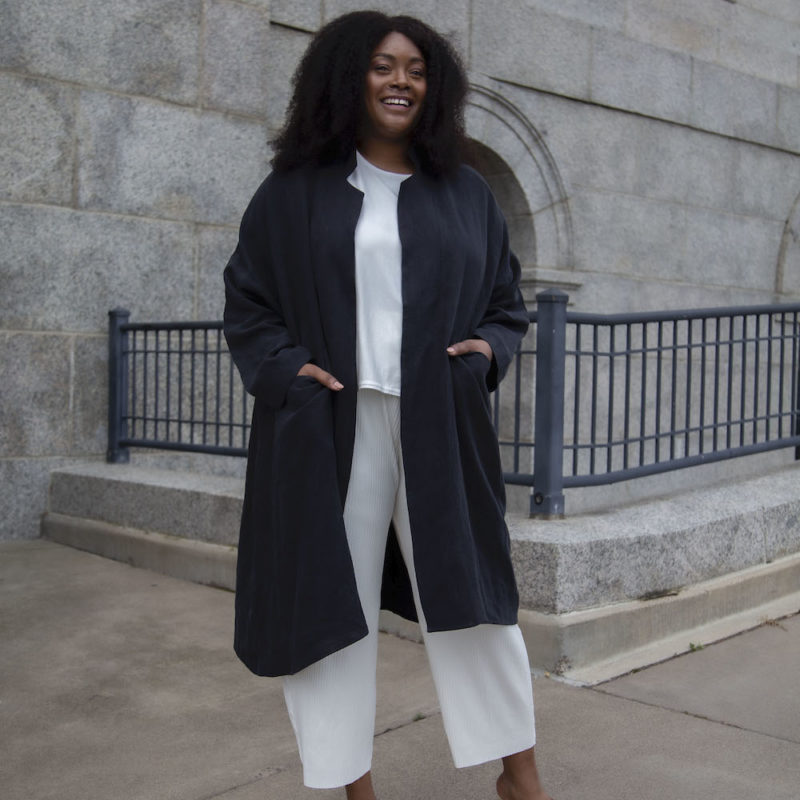 Front view of plus size model wearing Lapel Midi Jacket in Black Linen.