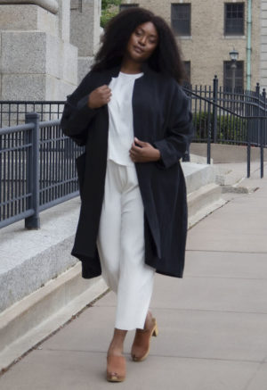 Front view of plus size model wearing Lapel Midi Jacket in Black Linen.