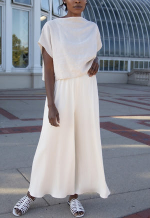 Front view of straight size model wearing Boatneck Crop Top in Oatmeal Linen.