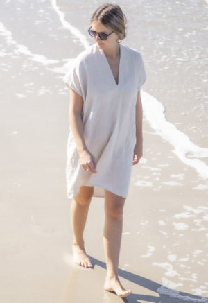 Front view of straight size model wearing Double V Kaftan in Oatmeal Linen.