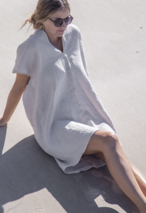 Front view of straight size model wearing Double V Kaftan in Oatmeal Linen.