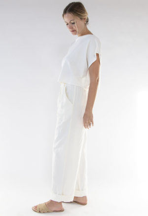 Side view of straight size model wearing Ivory Rib Cropped Rib Boatneck Top.