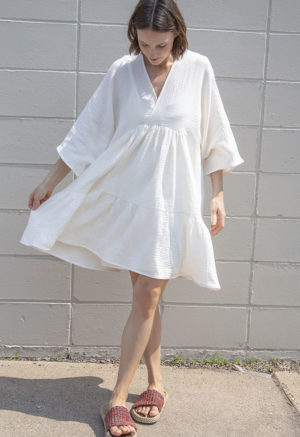 Front view of straight size model wearing Cream Gauze Short Tiered Dress.