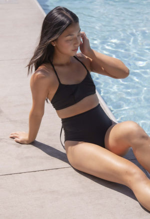 Front view of straight size model wearing Black Ruched Top.