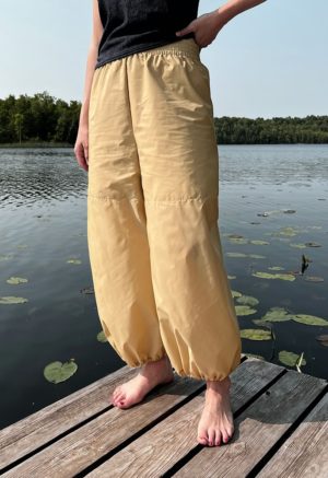 woman in tan/yellow wide-leg pant with balloon cuff