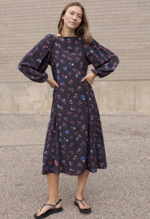 woman in black floral balloon sleeve midi dress