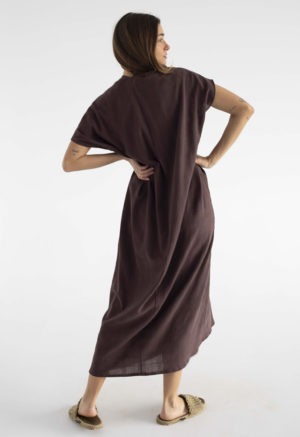 woman in dark brown kaftan with pleat in the front v-neck