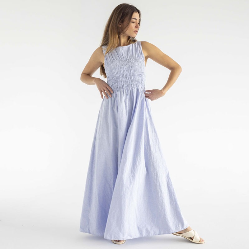 woman in light blue cotton ruched maxi length sundress