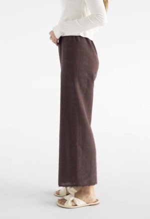 woman in brown cotton gauze pants and white rib shirt