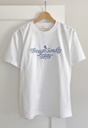 white t-shirt with blue embroidery on front chest
