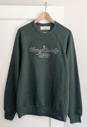 dark forest green sweatshirt with white embroidery