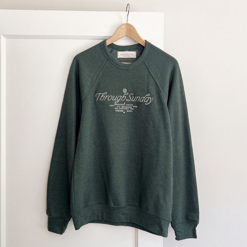 dark forest green sweatshirt with white embroidery