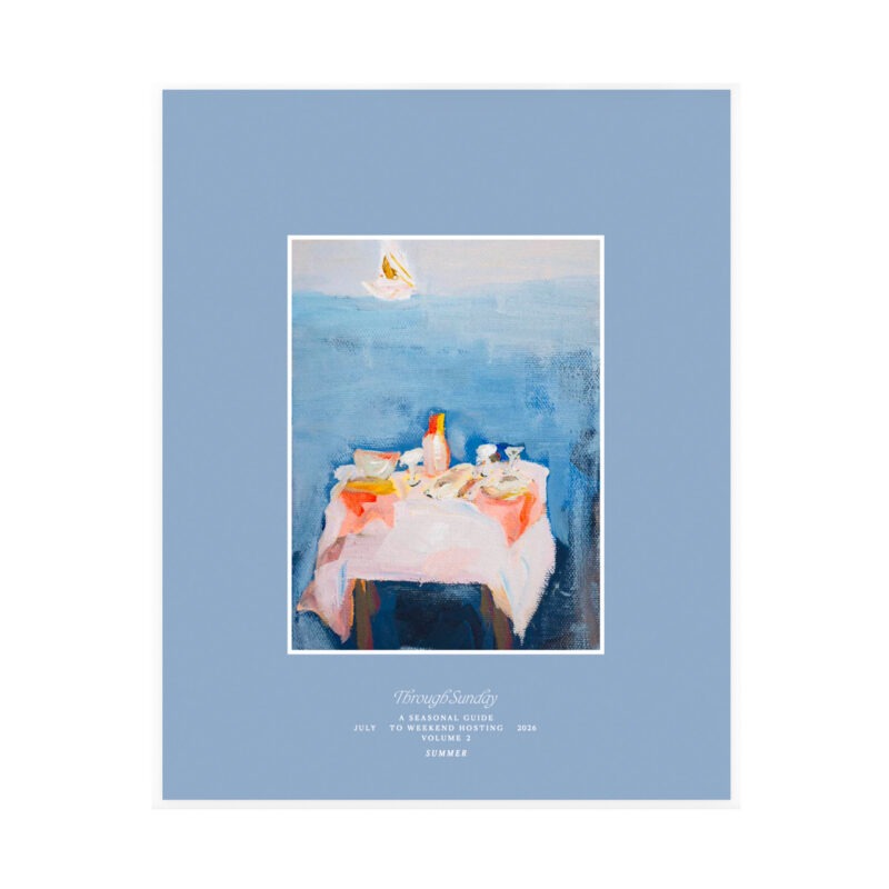 light blue cover of magazine with painting of table in water