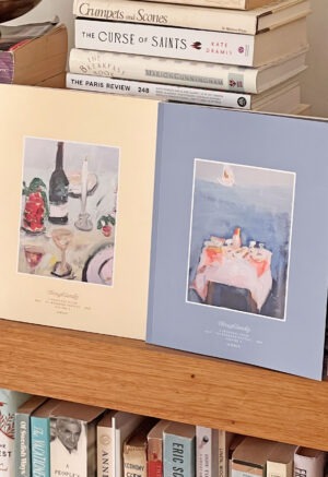 yellow and blue book sitting on bookshelf