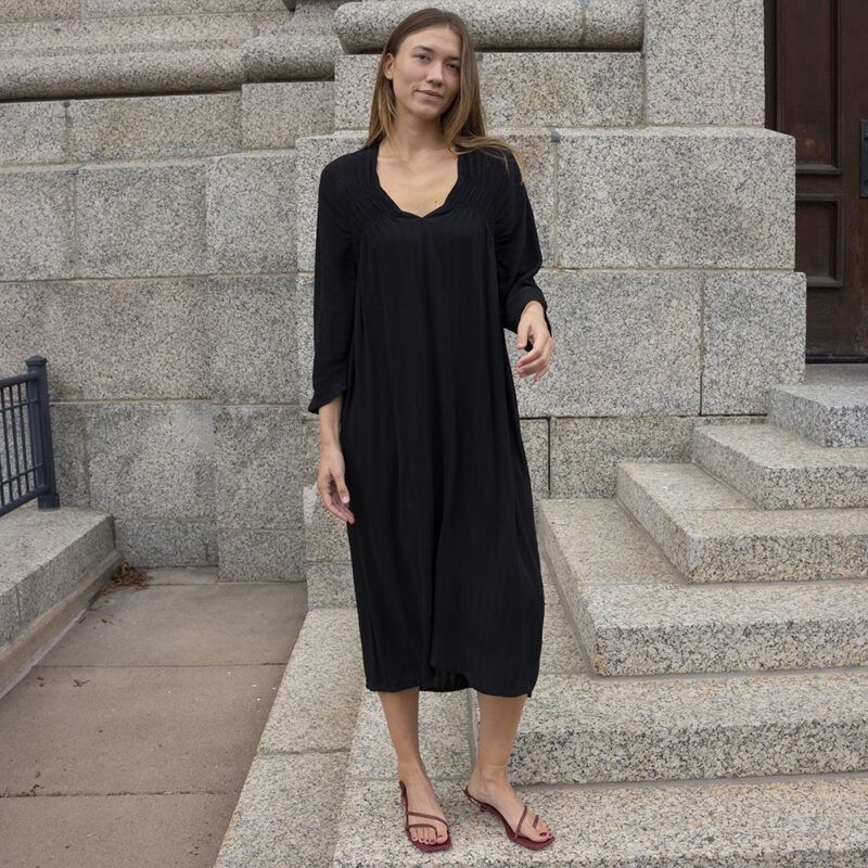 woman in black v-neck dress