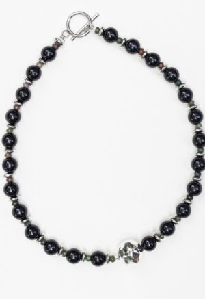 black necklace on white background