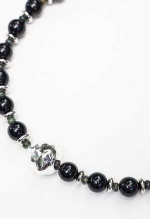 black necklace on white background