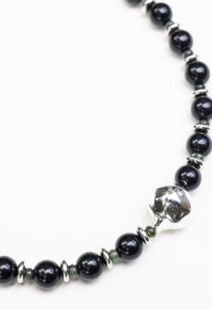black necklace on white background