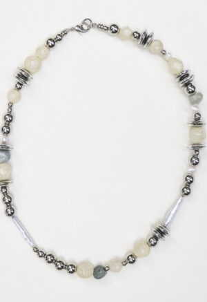 close up of silver, pearl, rock necklace