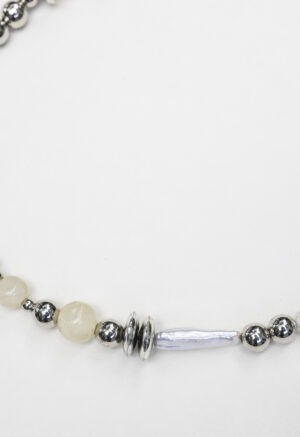 close up of silver, pearl, rock necklace