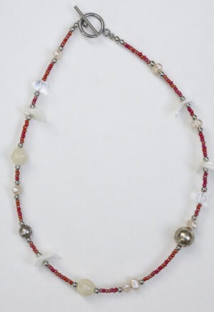 small red beaded necklace with pearls and shells