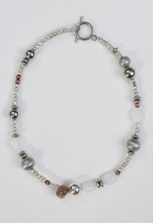 Necklace of silver, white rocks and red rocks