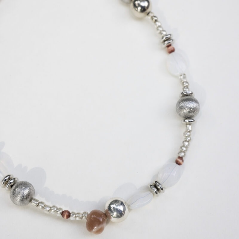 Necklace of silver, white rocks and red rocks