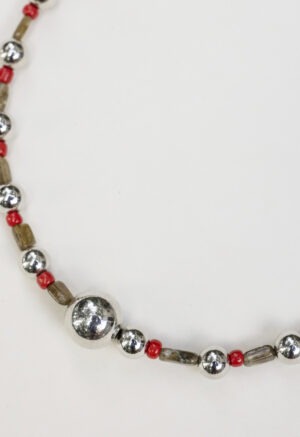 red, green and silver necklace