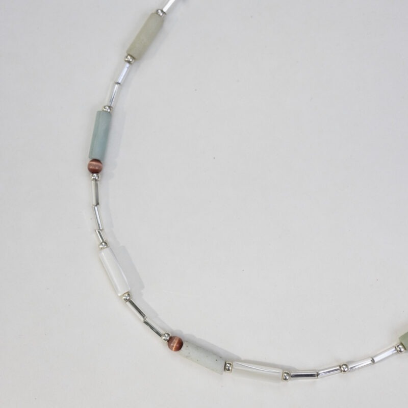 necklace of light green, red and silver beads