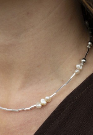 pearl and silver necklace on woman