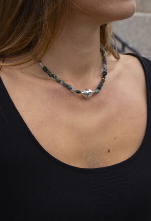 green rock bead necklace on woman