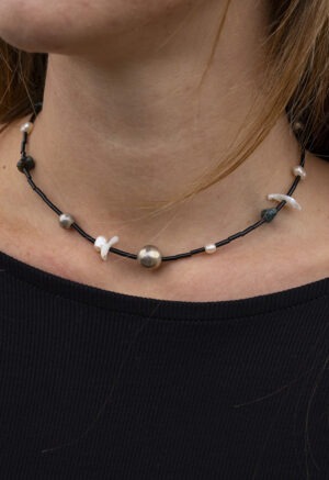 black necklace on woman