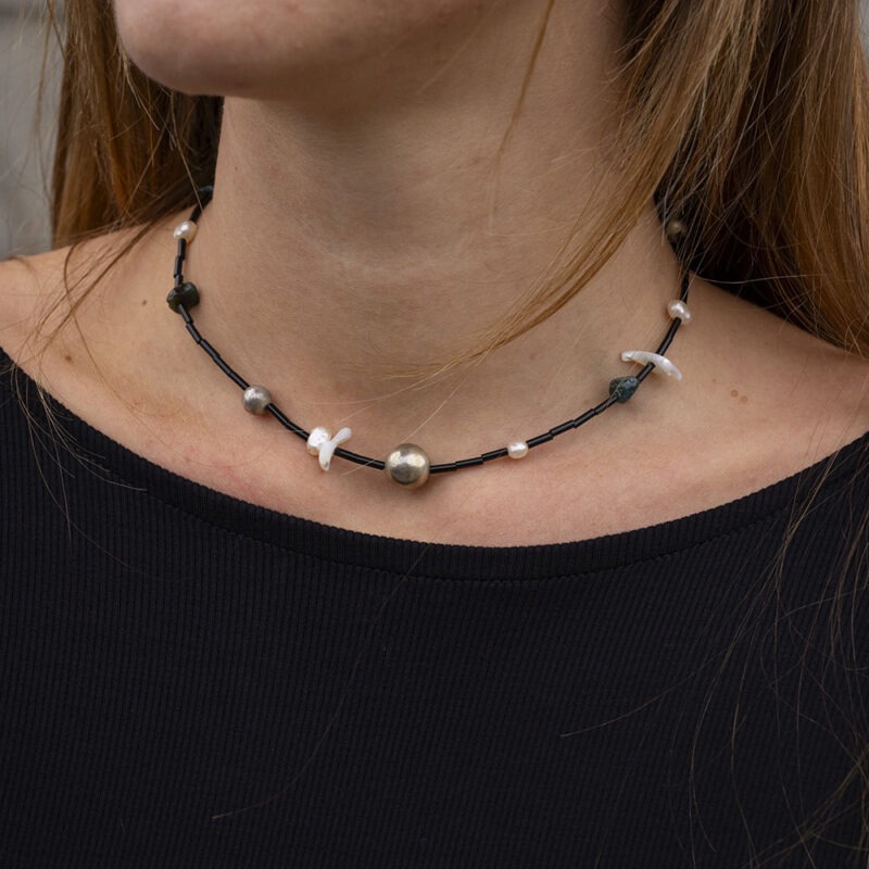 black necklace on woman