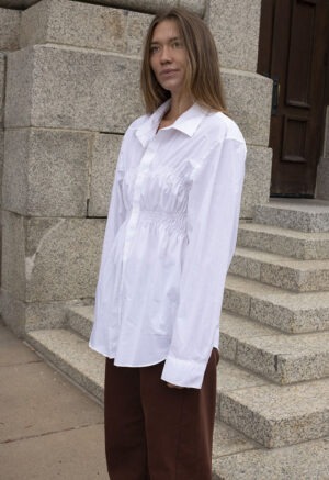 woman in white button-up