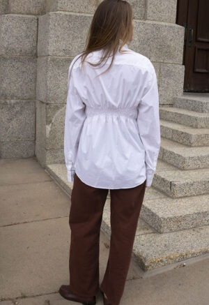 woman in white button-up