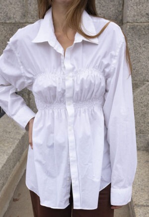 woman in white button-up