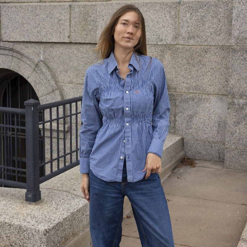 woman in blue and white stripe button-up shirt