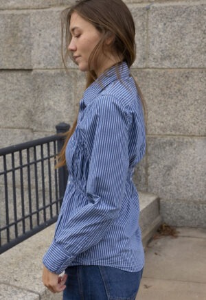 woman in blue and white stripe button-up shirt