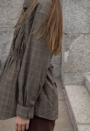 woman in plaid button-up