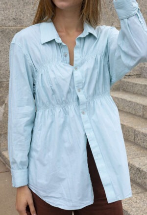 woman in teal button-up