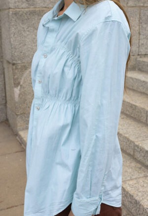 woman in teal button-up