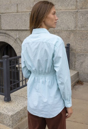 woman in teal button-up