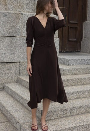woman in dark brown v-neck midi dress